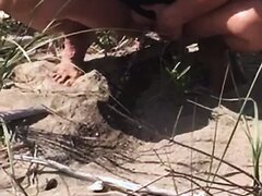 Shaved MILF Pees At The Beach