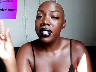 Pierced Bald Ebony Woman Talks Solo About BDSM On Camera